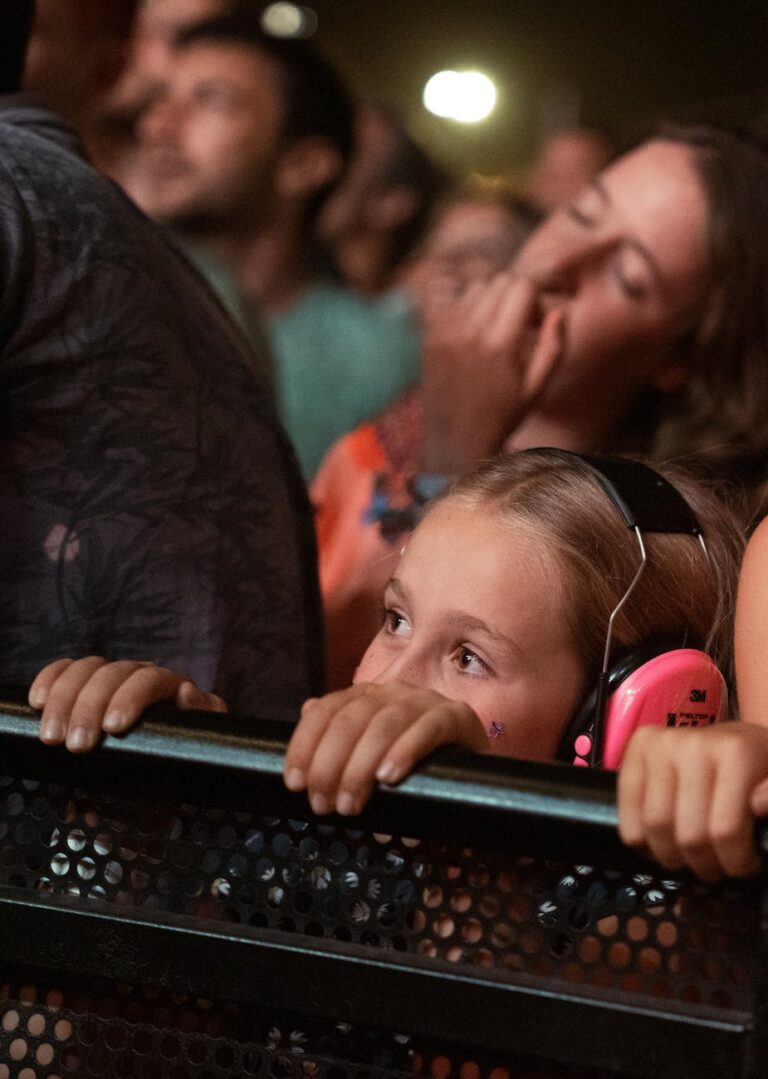 crowd at a concert with young girl in the front