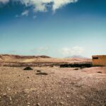 white concrete building on desert