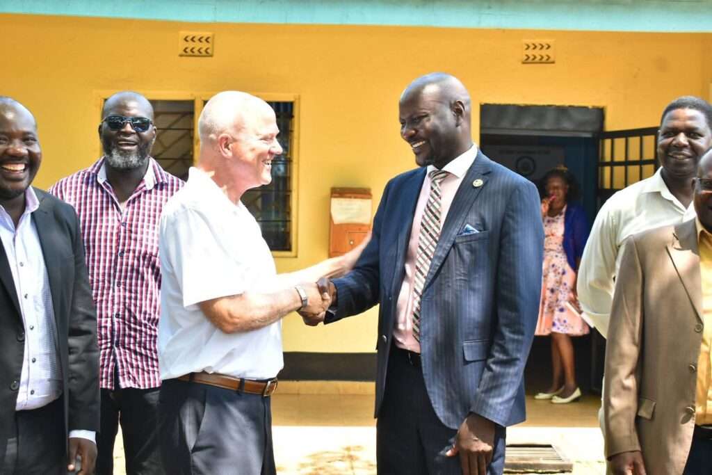 Suma Grow Director Tim Gammon (Left), Siaya County Official (Right).
